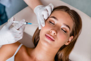 young woman receiving botox facial injection at medical spa